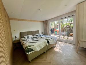 Kindvriendelijk sfeervol vakantiehuis Bosgeneugte bij zwembad op de Veluwe