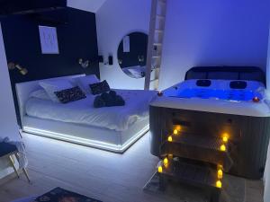 Appartements Suite romantique avec Spa et filet suspendu : photos des chambres