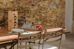 Maisons de vacances Maison Gilberte - Avec terrasse au coeur du village : photos des chambres