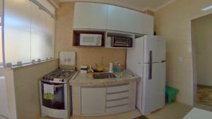 Book Santos - Enorme em frente a praia do Embaré