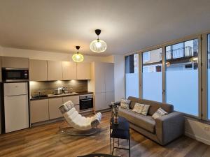 Appartements 4, 5 et 10 personnes renoves en centre-ville : photos des chambres