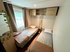 Campings Tiki House M-Home-Climatise - Belle parcelle ! : photos des chambres
