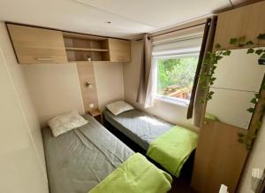 Campings Tiki House M-Home-Climatise - Belle parcelle ! : photos des chambres