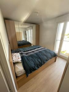 Appartements Appartement tres lumineux proche Metro Asnieres : photos des chambres