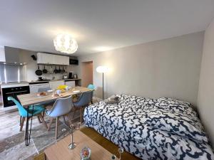 Appartements Le Troglodyte - Home Homy : photos des chambres