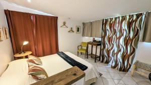 Appartements A la ville comme a la campagne : photos des chambres