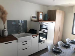 Appartements Ty Bihan - Coeur de bourg : photos des chambres