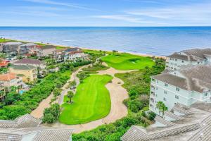 Spacious fourth-floor beachfront condo with pools, hot tub, fitness room