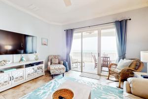 Spacious fourth-floor beachfront condo with pools, hot tub, fitness room