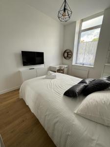 Appartements Le National Appartement centre-ville : photos des chambres
