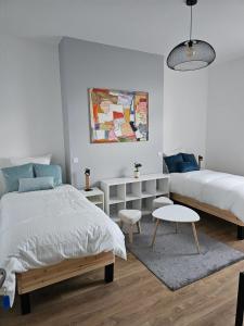 Appartements Le National Appartement centre-ville : photos des chambres