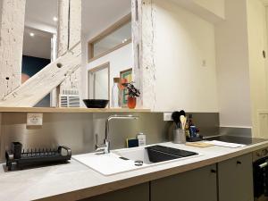 Appartements L-Equinoxe - Coeur de ville avec terrasse : photos des chambres
