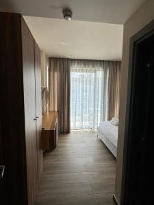 Deluxe Double Room with Balcony and Side Sea View room in Hotel Utopia