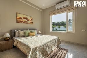 Arcadian Manor with Indoor Pool Indoor-Outdoor Games at Varanasi by StayVista