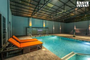 Arcadian Manor with Indoor Pool Indoor-Outdoor Games at Varanasi by StayVista