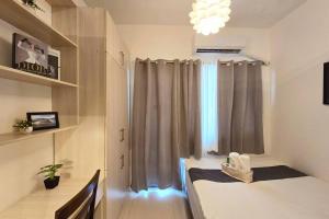 1BR Condotel with Balcony at FAME Residences #FM13