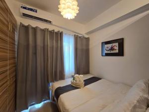 1BR Condotel with Balcony at FAME Residences #FM14