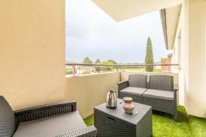 Appartements Cosy apartment with pool : photos des chambres