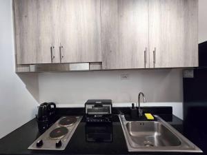 1BR Condotel with Balcony at FAME Residences #FM23