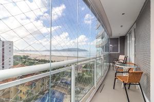 AP OCEAN UNLIMITED - Vista panorâmica da praia de Santos no Unlimited