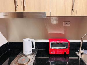 1BR Condotel with Balcony at FAME Residences #FM28