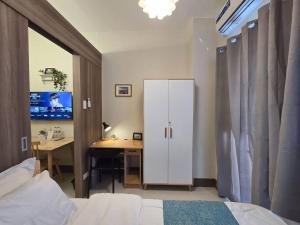 1BR Condotel with Balcony at FAME Residences #FM33