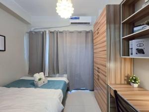 1BR Condotel with Balcony at FAME Residences #FM38