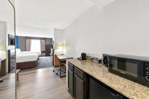 Queen Room with Two Queen Beds and Sofa Bed room in Comfort Suites East