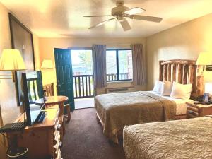 Queen Room with Two Queen Beds and Bridge View room in Super 8 by Wyndham Bridgeview of Mackinaw City
