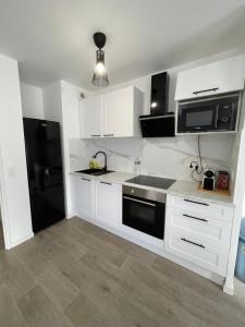 Appartements Appartement cosy proche Paris : photos des chambres