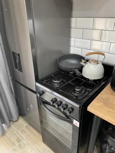 PINE COTTAGE Self catering fully equipped 2 bedroom, Queen bed 3 singles 65sqm cosy private cottage