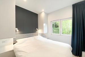 Ralreiger Chaletlodge met airco, tuin op het zuiden en fietsenberging