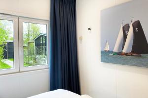 Ralreiger Chaletlodge met airco, tuin op het zuiden en fietsenberging