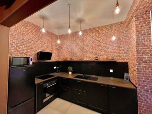 Appartements Repaire du sorcier, escape game, nuit atypique : photos des chambres