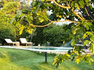 Maisons de vacances Charmante maisonnette avec jardin et piscine : photos des chambres
