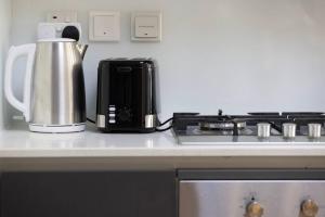 Large 1BR in JVC Sleeps 4 Rooftop, Pool & Gym