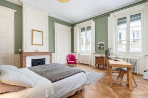 Appartements L-Authentique - Appartement en coeur de ville : photos des chambres
