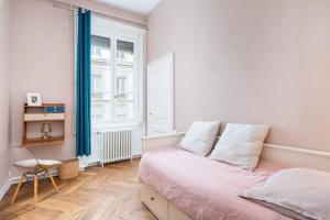 Appartements L-Authentique - Appartement en coeur de ville : photos des chambres
