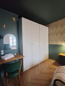Appartements L'Oiseau vert - calme, ressourcant et proche du centre ville : photos des chambres