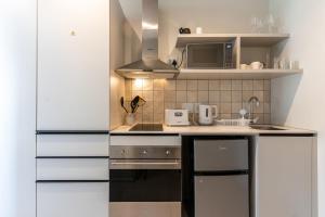 The Rose 107: Modern Corner Unit with Balcony ~