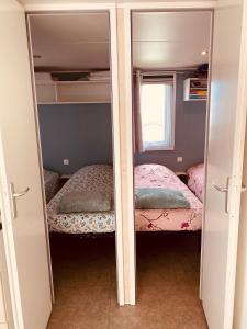 Campings Mobilhome P27 6 personnes climatise : photos des chambres