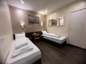Twin Room with Private Bathroom room in Dam Hotel