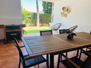 Impeccable large apartment with immense terrace and private garden overlooking the mountain, featuring 2 bedrooms and sleeping up to 4 guests located 100 meters from Plaza Maestranza