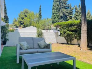 Impeccable large apartment with immense terrace and private garden overlooking the mountain, featuring 2 bedrooms and sleeping up to 4 guests located 100 meters from Plaza Maestranza