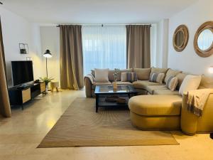 Impeccable large apartment with immense terrace and private garden overlooking the mountain, featuring 2 bedrooms and sleeping up to 4 guests located 100 meters from Plaza Maestranza