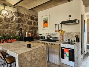 Appartements Ancienne cave a vin renovee : photos des chambres