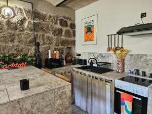 Appartements Ancienne cave a vin renovee : photos des chambres