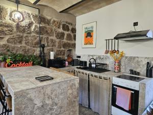 Appartements Ancienne cave a vin renovee : photos des chambres