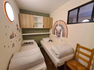 Appartements Escapade Montagne en Famille, appartement cosy avec piscine couverte : photos des chambres