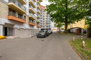 Wyjątkowy Apartament z Parkingiem Blisko Morza by Noclegi Renters